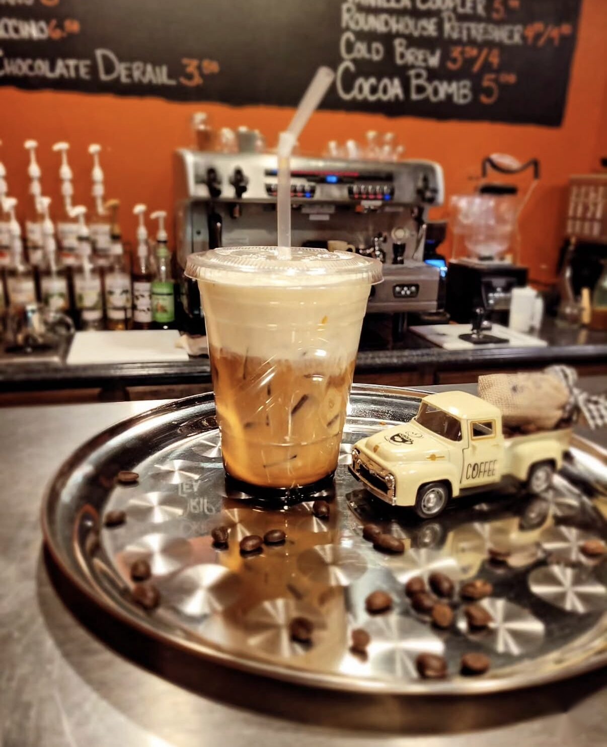 The espresso counter and chalkboard menu at Trackside Coffee Bar